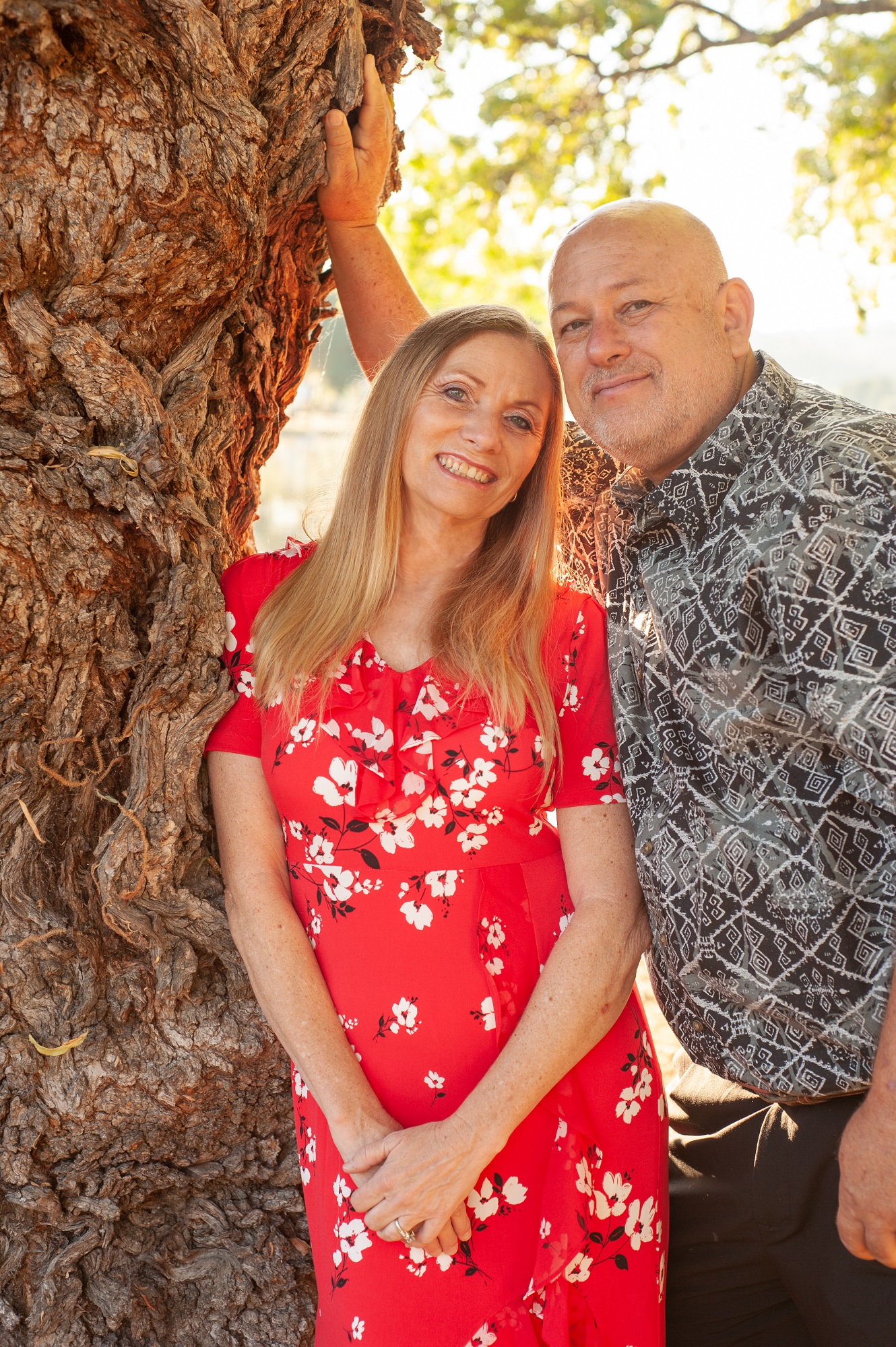 Douglas and Dana Palmer standing together near a tree Douglas and Dana Palmer standing together near a tree